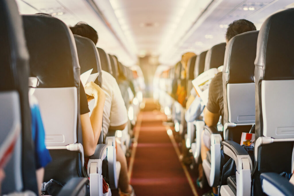 Image of airliner cabin with passengers